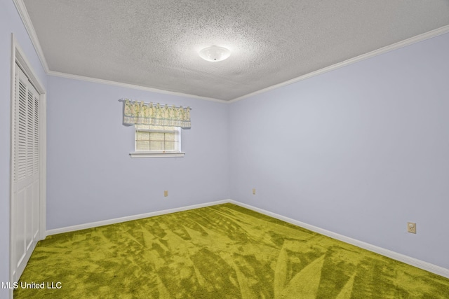 unfurnished bedroom featuring a textured ceiling, a closet, ornamental molding, carpet floors, and baseboards