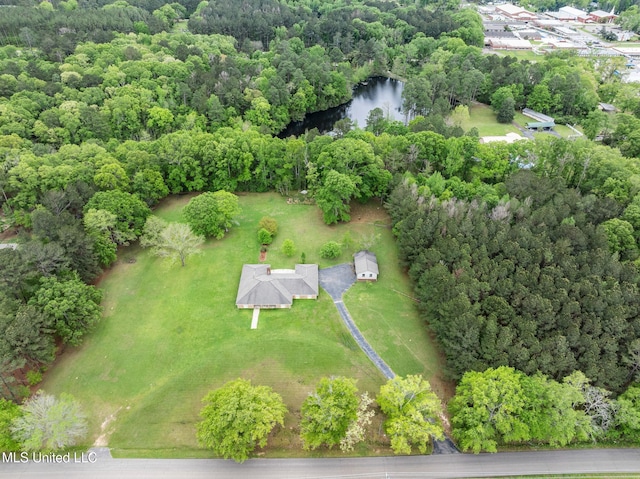 aerial view with a water view and a wooded view