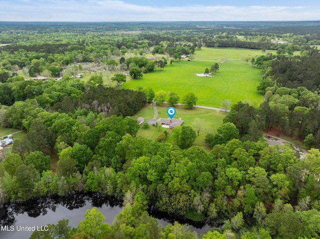 birds eye view of property with a wooded view