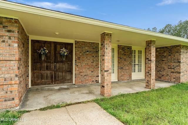 entrance to property with brick siding