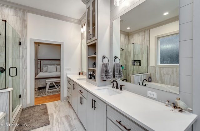 bathroom featuring an enclosed shower, vanity, and ornamental molding