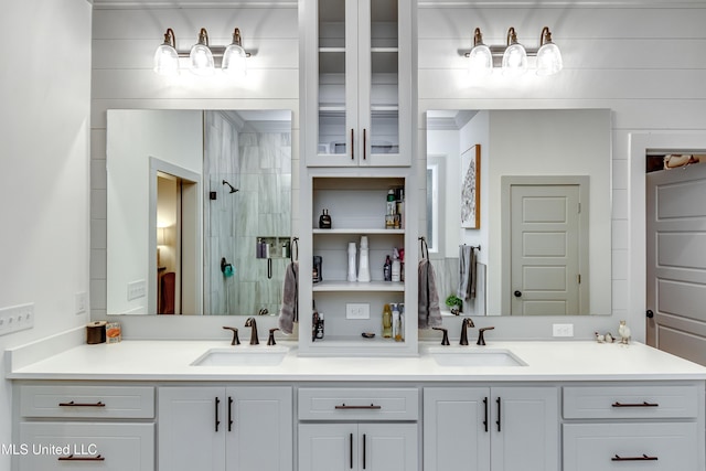 bathroom featuring an enclosed shower and vanity