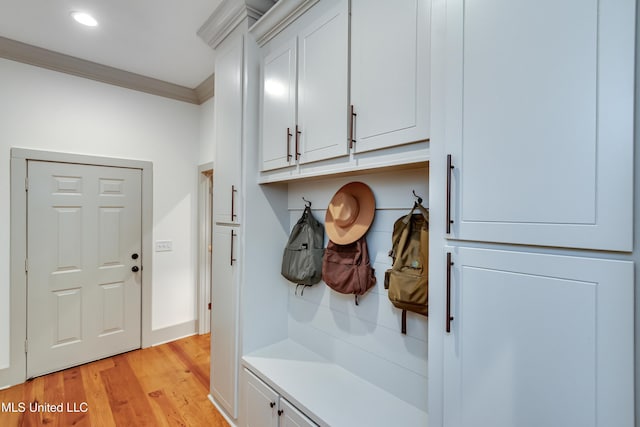 mudroom with crown molding and light wood-type flooring