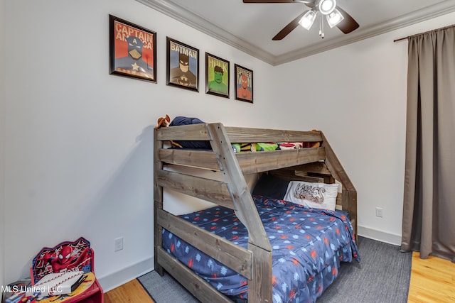 bedroom with ceiling fan, wood-type flooring, and ornamental molding