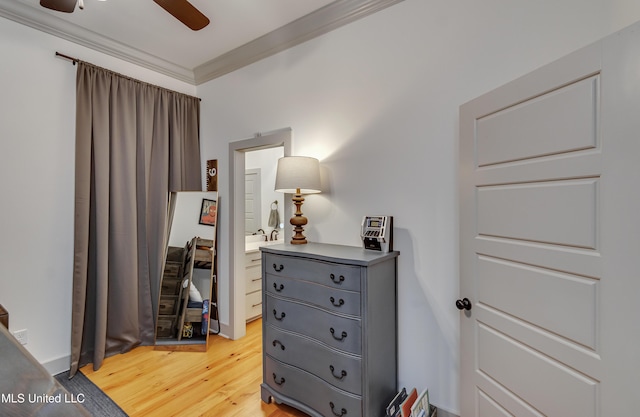 interior space with ceiling fan, wood-type flooring, and crown molding