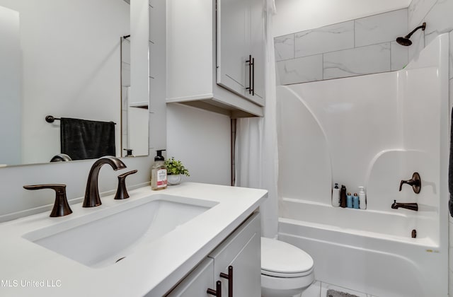 full bathroom with toilet, vanity, and  shower combination