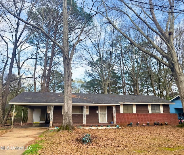 ranch-style house with a carport