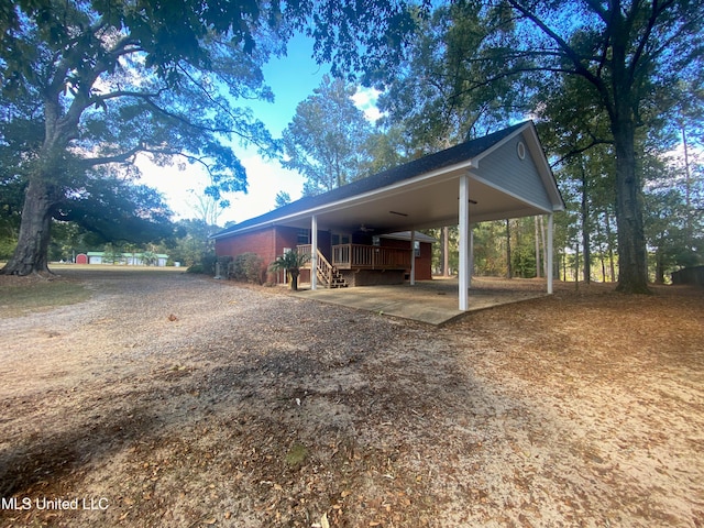 exterior space featuring a carport