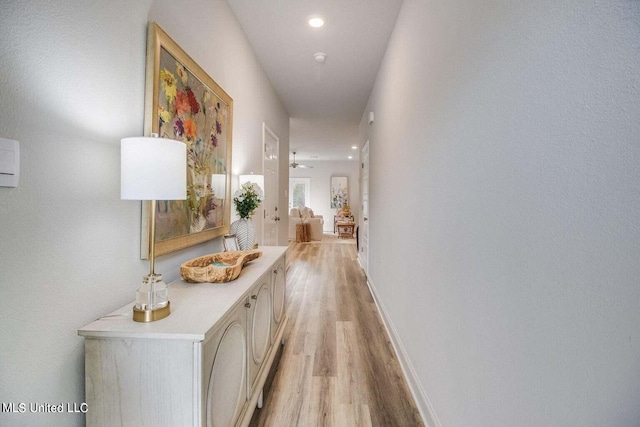 hallway featuring light wood-type flooring