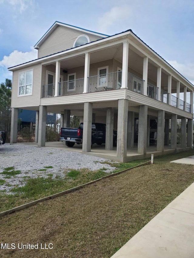 exterior space with a carport and driveway