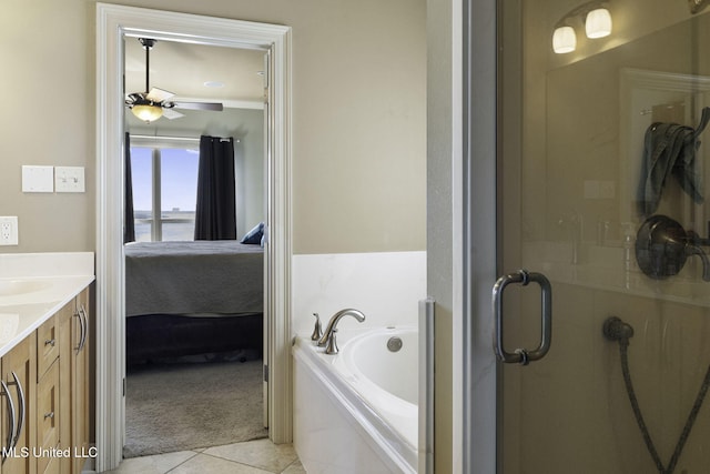 ensuite bathroom with a stall shower, connected bathroom, a garden tub, tile patterned flooring, and vanity