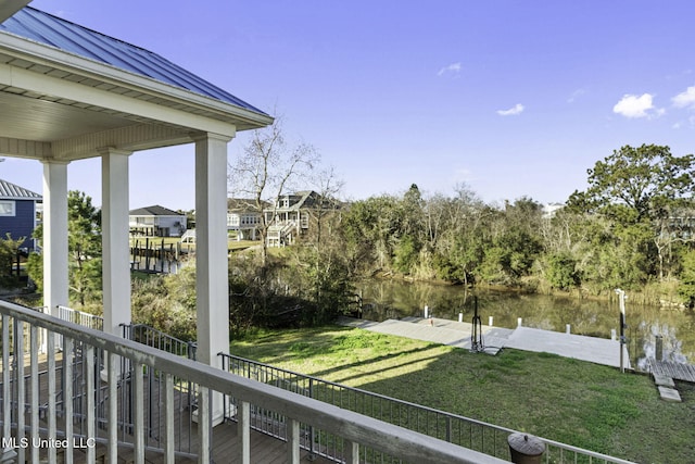 balcony with a dock and a water view