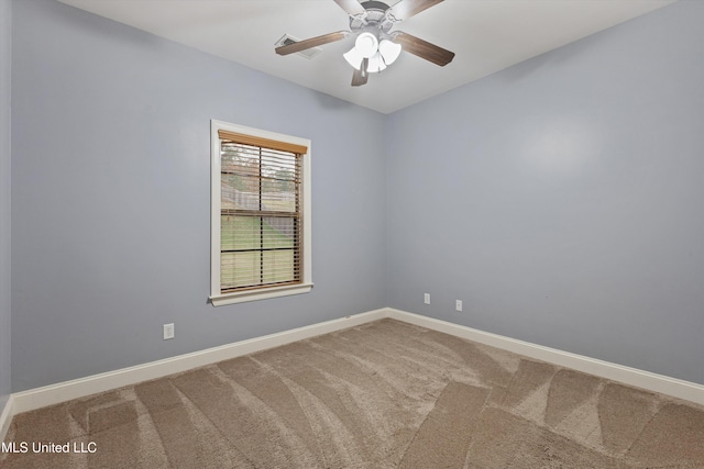 empty room featuring carpet flooring and ceiling fan