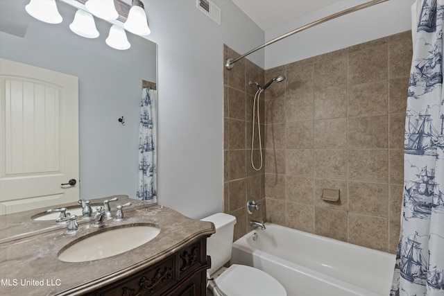 full bathroom with shower / bath combo, toilet, and vanity