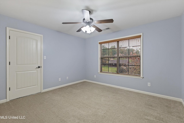 empty room with carpet floors and ceiling fan