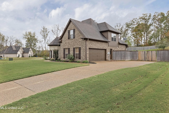 view of front of home with a garage and a front yard