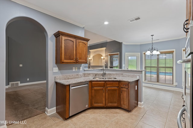 kitchen with light stone countertops, dishwasher, a notable chandelier, and sink