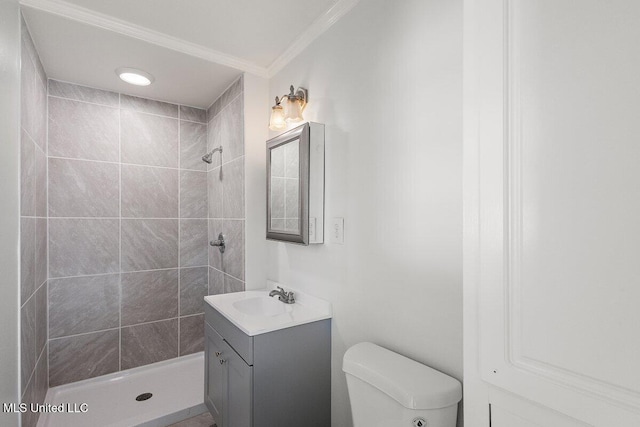 203 Bruin Ave, Pearl, MS 39208 - full bathroom with vanity, a tile shower, toilet, and crown molding