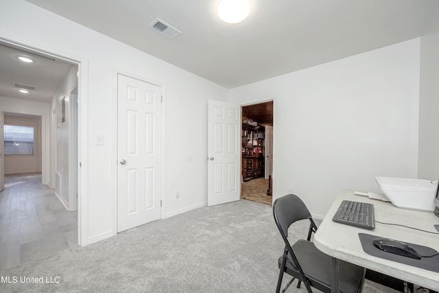 office area with light colored carpet