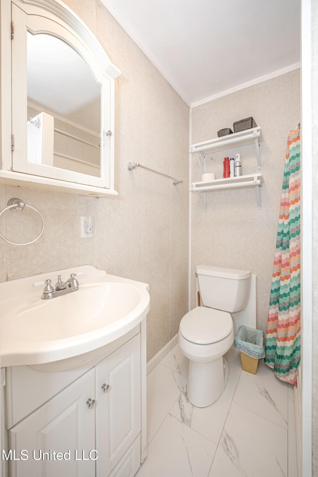 bathroom featuring vanity, toilet, crown molding, and tile walls