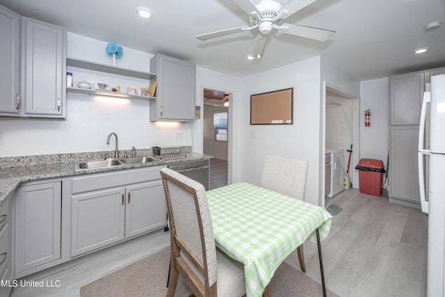 kitchen featuring light hardwood / wood-style flooring, gray cabinetry, and sink