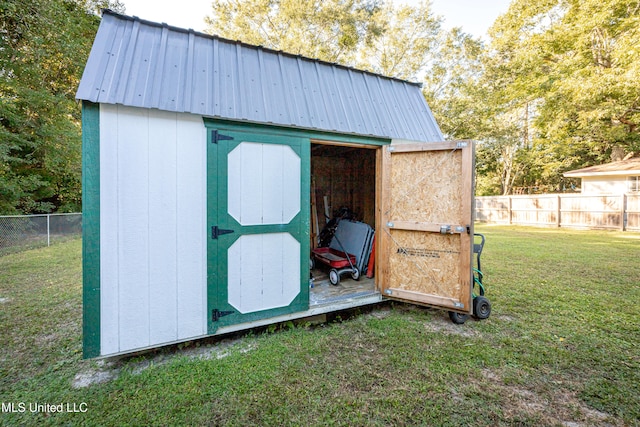 view of outdoor structure with a yard