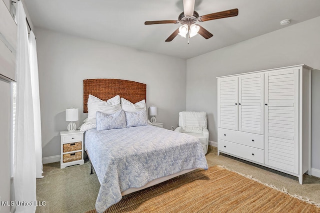 carpeted bedroom with ceiling fan