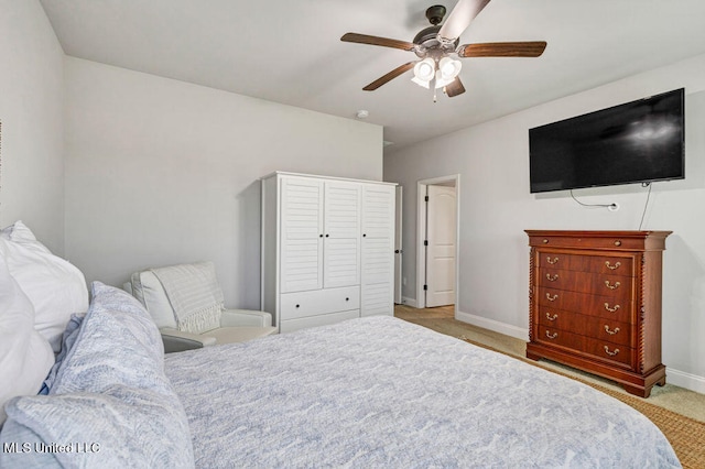 carpeted bedroom featuring ceiling fan