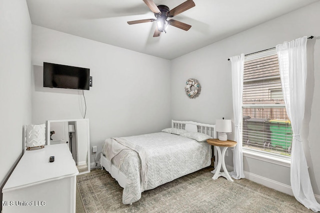 carpeted bedroom featuring ceiling fan