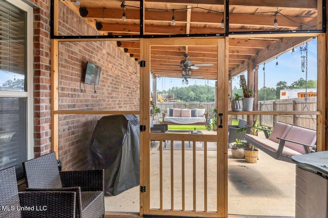 view of patio featuring ceiling fan and grilling area