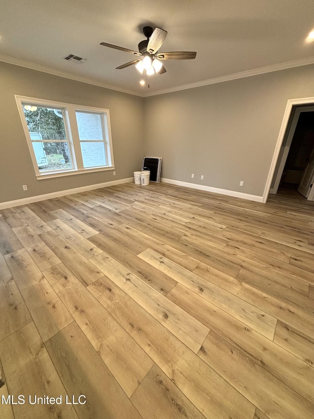 interior space with crown molding, light hardwood / wood-style floors, and ceiling fan