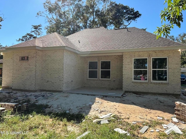 rear view of property featuring a patio area