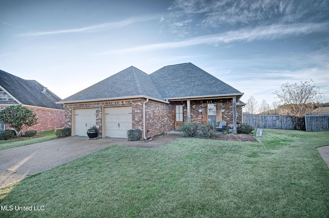 view of front of house with a front yard and a garage