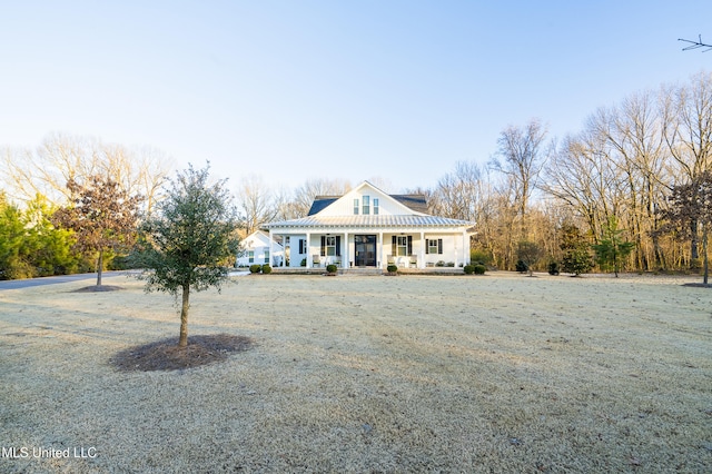 view of front of house with a front lawn and a porch