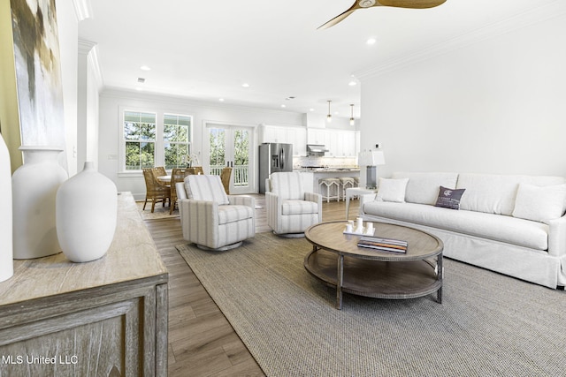 211 Chartres St, Bay Saint Louis, MS 39520 - living area with crown molding, wood finished floors, recessed lighting, and ceiling fan