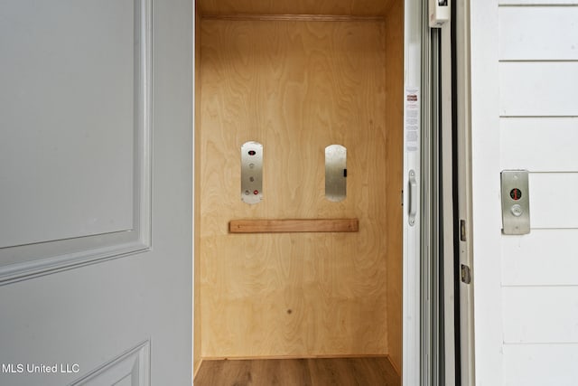 211 Chartres St, Bay Saint Louis, MS 39520 - elevator featuring wood finished floors