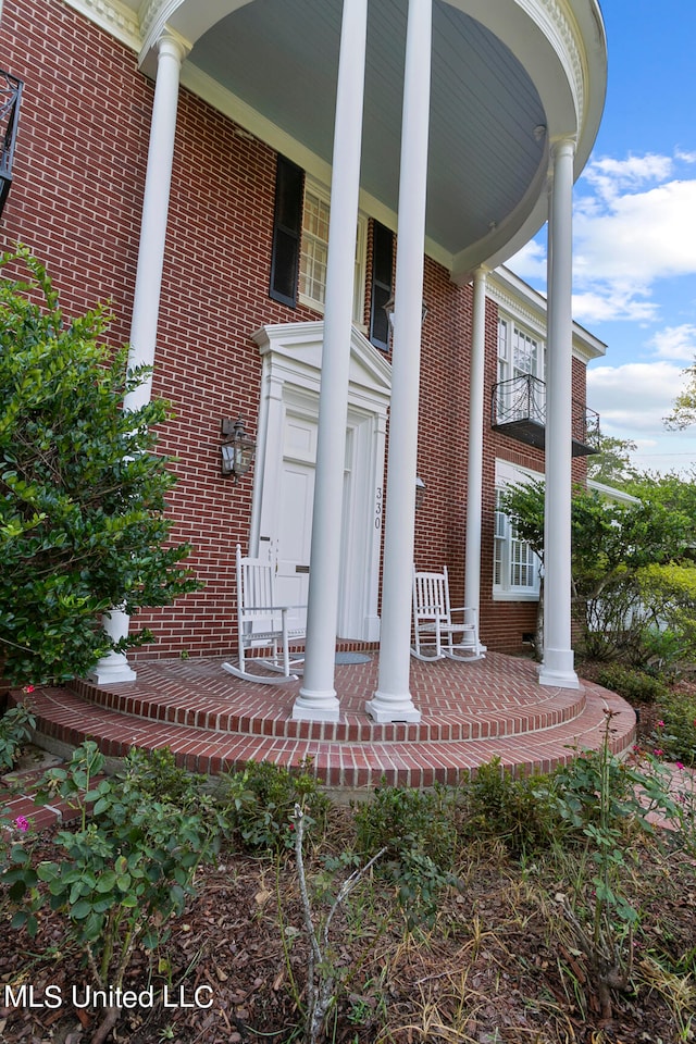 entrance to property with a porch