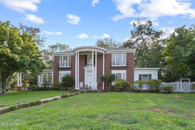 greek revival house with a front lawn