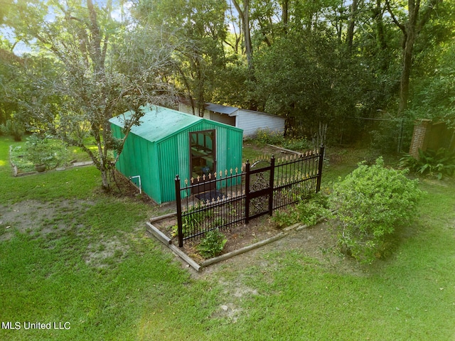 view of outdoor structure featuring a lawn