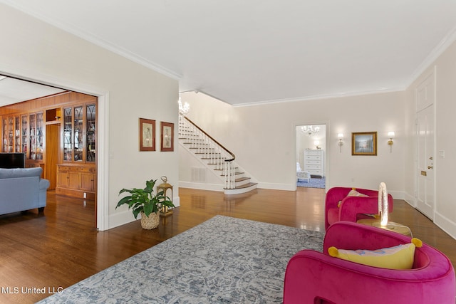 living room with crown molding and dark hardwood / wood-style flooring