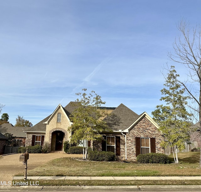 view of front of home with a front lawn