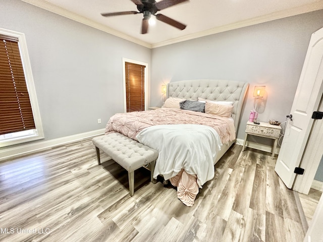 bedroom featuring ceiling fan, light hardwood / wood-style floors, and ornamental molding