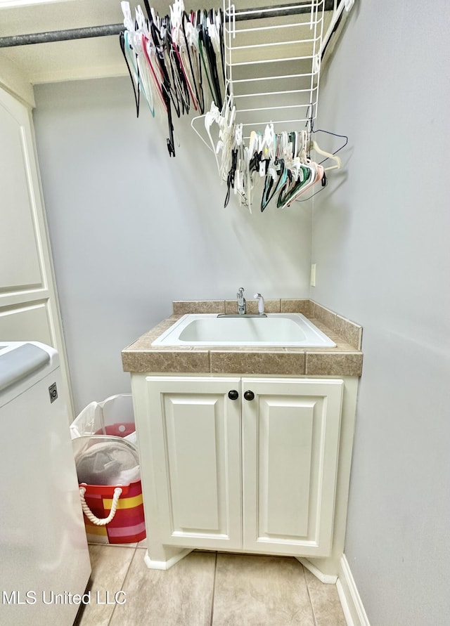 bathroom featuring tile patterned floors, sink, and toilet