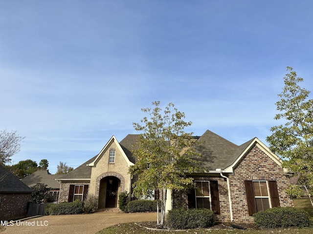 715 Tortoise Rdg, Brandon, MS 39047 - view of front facade featuring brick siding and a shingled roof