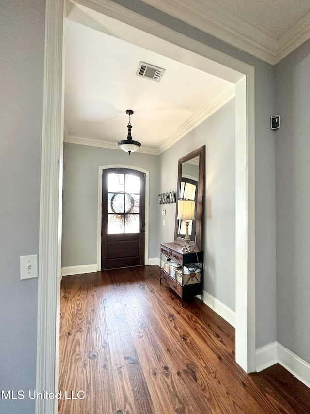 entrance foyer with crown molding and hardwood / wood-style flooring