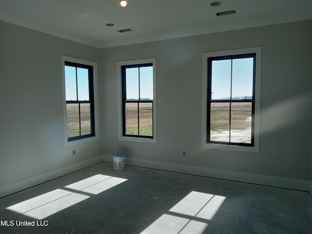 1400 Bayou Dr, Indianola, MS 38751 - unfurnished room with plenty of natural light, baseboards, and crown molding