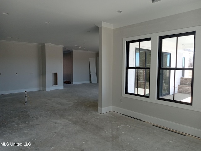 1400 Bayou Dr, Indianola, MS 38751 - empty room featuring ornamental molding, unfinished concrete floors, and baseboards