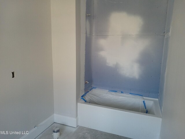 1400 Bayou Dr, Indianola, MS 38751 - bathroom featuring unfinished concrete floors and baseboards