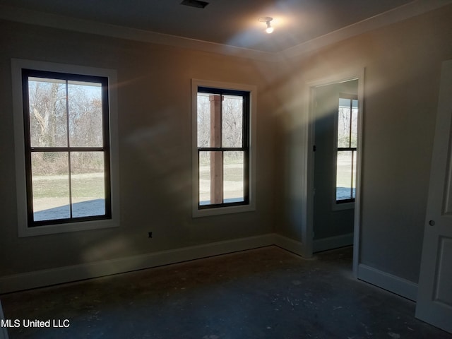 1400 Bayou Dr, Indianola, MS 38751 - spare room with baseboards, concrete floors, and crown molding