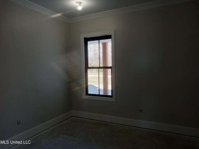 1400 Bayou Dr, Indianola, MS 38751 - spare room with baseboards, unfinished concrete floors, and ornamental molding